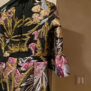 Marchesa Notte Excludive Elbow Trumpet Sleeve.